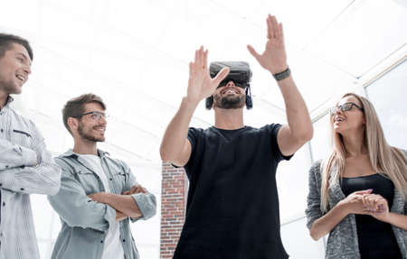 Businessman making gestures when wearing virtual reality goggles