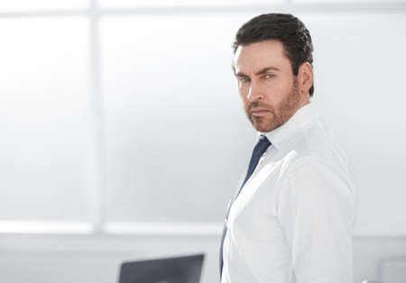 close up.confident businessman standing in the office