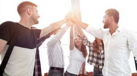 creative team giving each other a high five