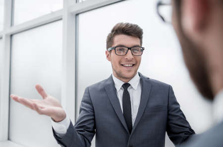 young businessman talking standing in the officeの写真素材