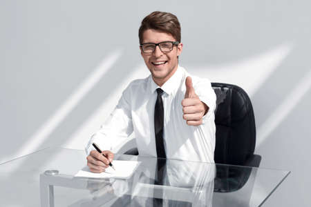 close up.smiling businessman pointing at you