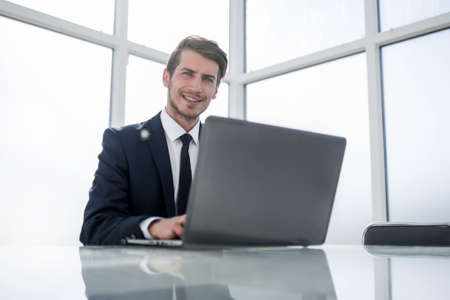 successful businessman working on a laptop
