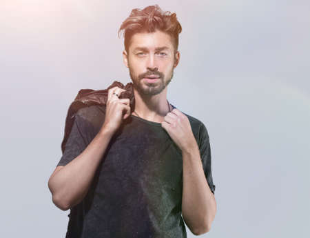 Portrait of a trendy bearded man on a gray backgroundの写真素材