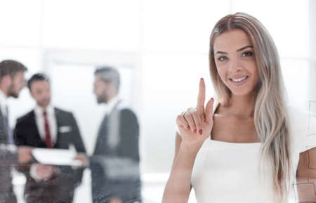 Business woman pushing on a glass Board.の写真素材