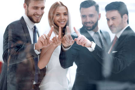 business team pointing to a virtual point