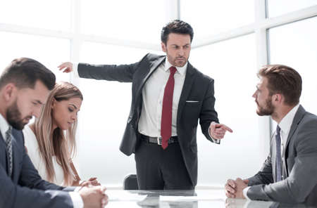 strict businessman pointing to the employee of the company at thの写真素材