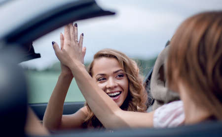close up.good friends giving each other high five.