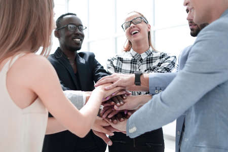 Business people joining hands in circle