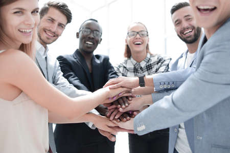 Business people joining hands in circle