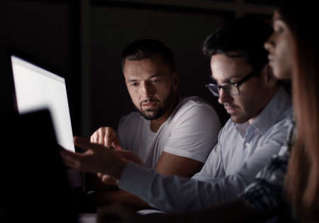 close up.tired employees working overtime.の写真素材