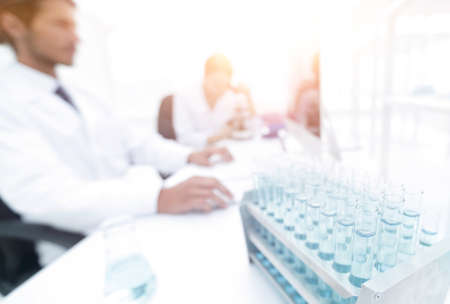 side view of scientists working in laboratoryの写真素材