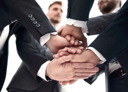 close up.business team adding a tower of hands