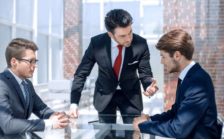 annoyed businessman scolds his employeesの写真素材
