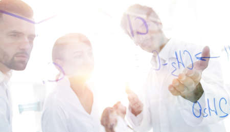 group of laboratory scientists discussing their research in theの写真素材