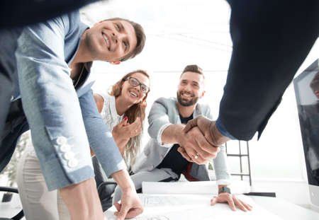 close up.businessman and architect shaking hands