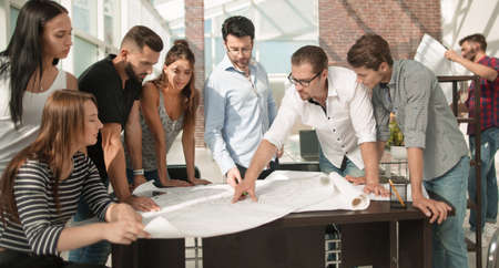 businessman discussing with the design team new sketchesの写真素材