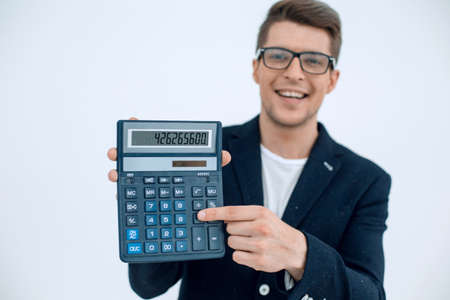 close up.smiling businessman showing calculatorの写真素材