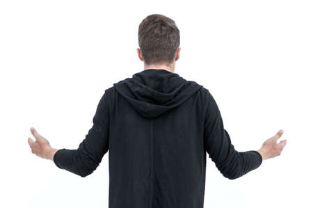 rear view .friendly guy in a hoodie looking ahead