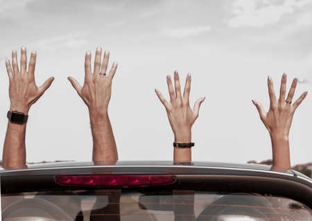 good friends traveling in a convertible