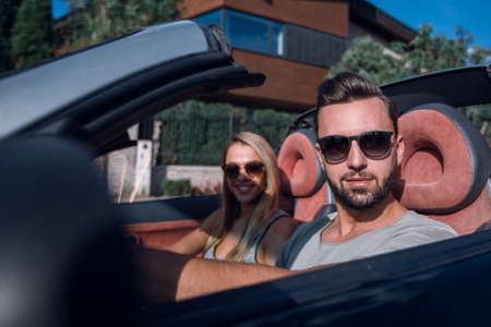 close up.beautiful couple sitting in a prestigious car