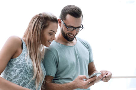 young couple using smartphone for online shopping