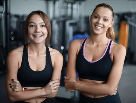two young woman on the background of the gymの写真素材