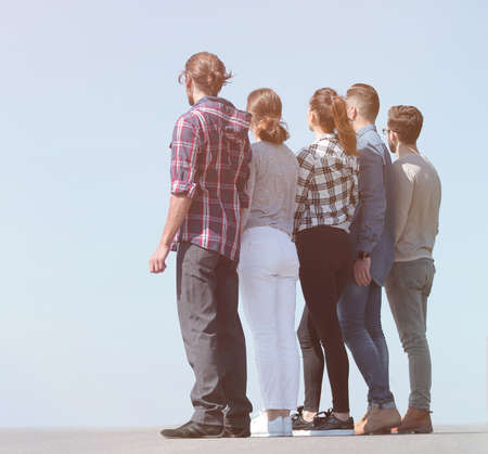 rear view .a group of students looking at copy space.