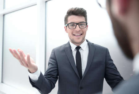 young businessman talking standing in the office