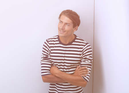 thoughtful man standing in the cornerの写真素材