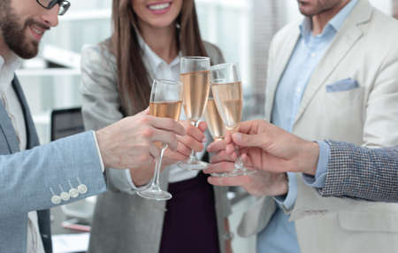 close up.glasses of champagne in the hands of the business team.の写真素材
