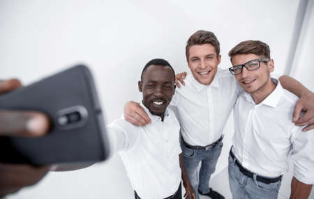 close up.friendly staff taking selfies
