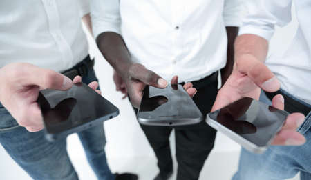 close up.business team using their smartphonesの写真素材