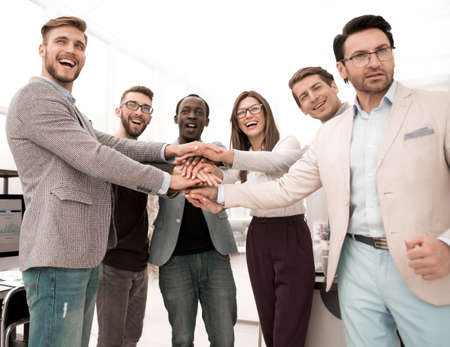 Business People teamwork stacking hands showing unityの写真素材