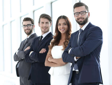 employees of the company standing in a bright office