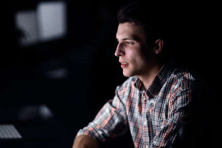 Tired employee working late .の写真素材