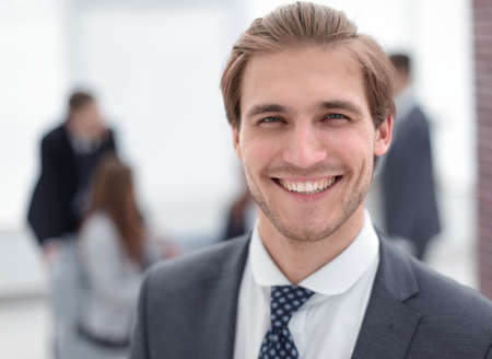 Portrait of a businessman in a modern officeの写真素材