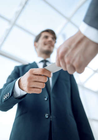 bottom view.business hands over his business cardの写真素材