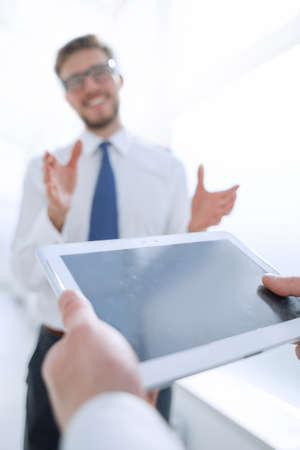 close up.businessman with digital tablet on office backgroundの写真素材