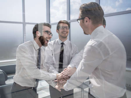 business team showing success with their hands togetherの写真素材