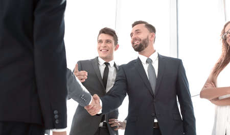handshake of young business partners in the officeの写真素材