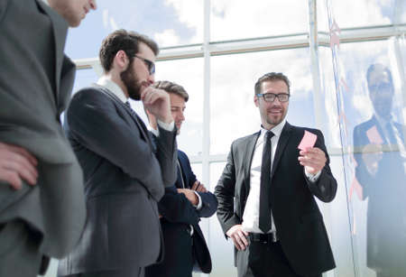 Businessman explaining new business strategy to colleagues