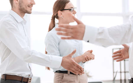 employees of the company, standing in the officeの写真素材