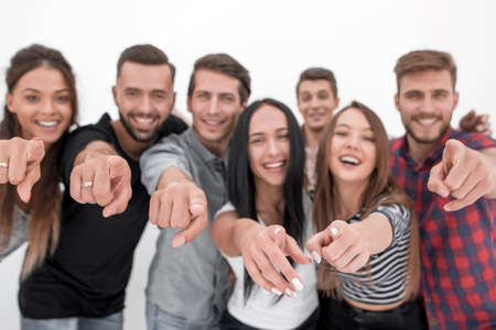 close up.a friendly team of young men pointing at youの写真素材