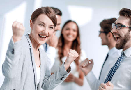 close up.happy business woman on the background of business teamの写真素材