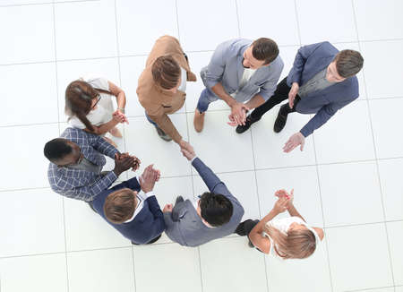 top view.business team and handshake of business partnersの写真素材