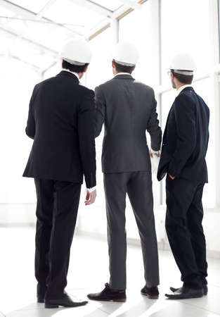 rear view.three architects looking at the copy spaceの写真素材