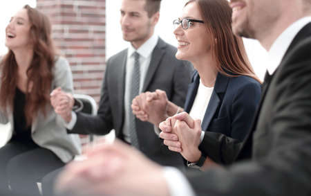 A group of businessmen holding hands in a circleの写真素材