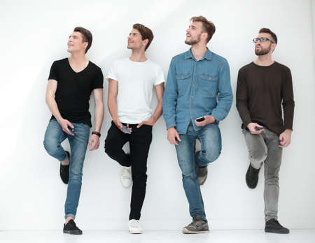 group of young people looking at a copy of the spaceの写真素材