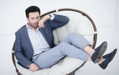 close up.tired businessman resting in a comfortable chair