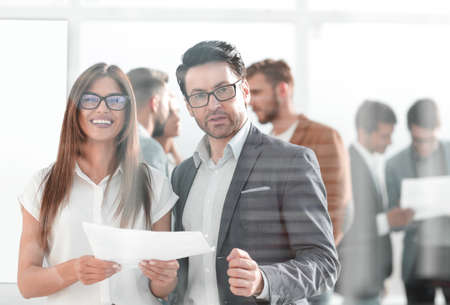 business partners with a business document